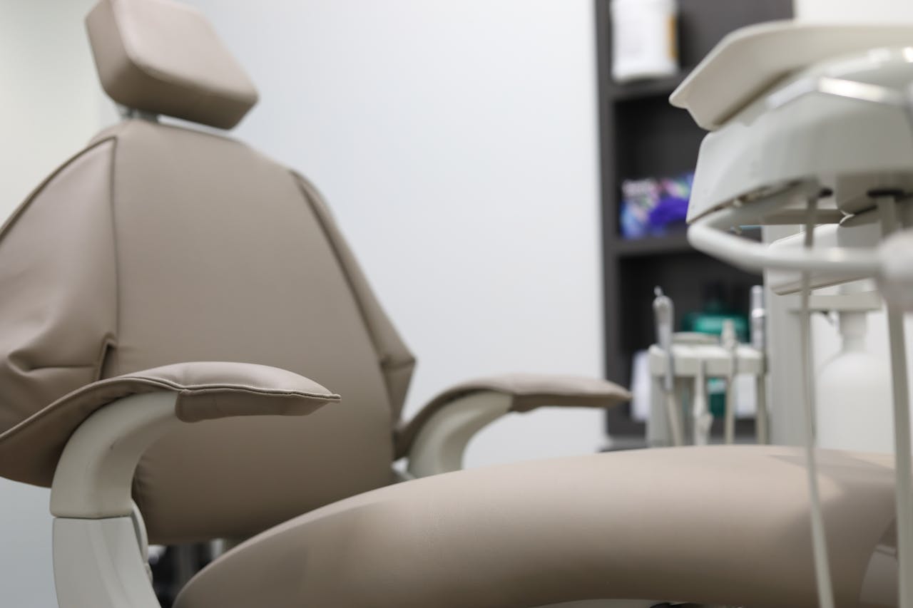 services-04 Close-up of dental chair and equipment in a clinical setting, emphasizing healthcare technology.